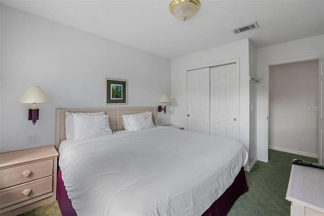 carpeted bedroom featuring a closet