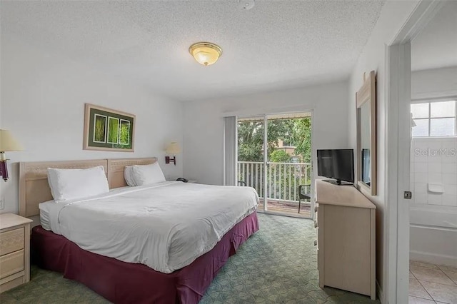 bedroom with a textured ceiling and access to outside