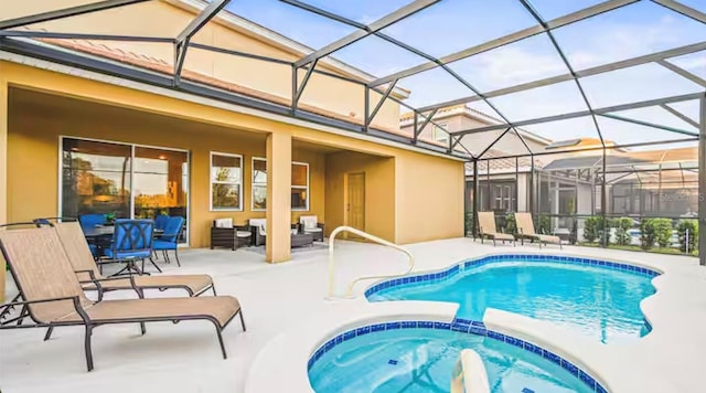 view of pool with an in ground hot tub, a patio, and a lanai