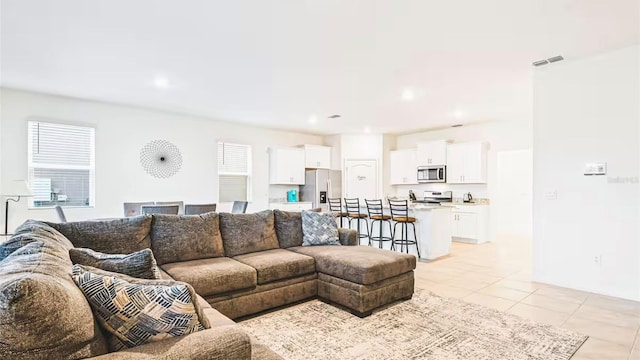 living room featuring light tile patterned floors