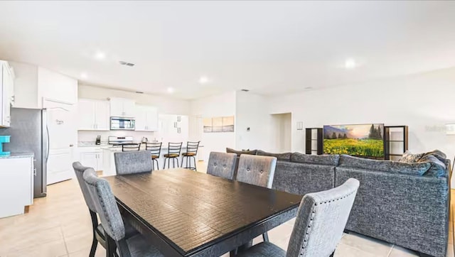 dining space with light tile patterned flooring