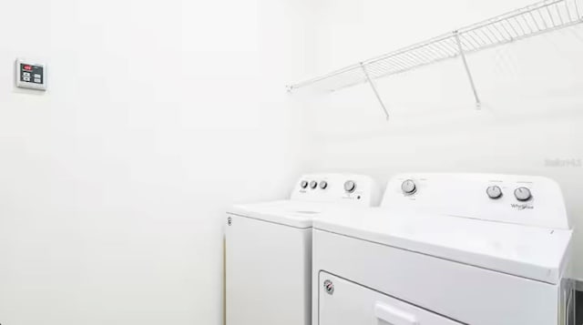 laundry area with washer and clothes dryer