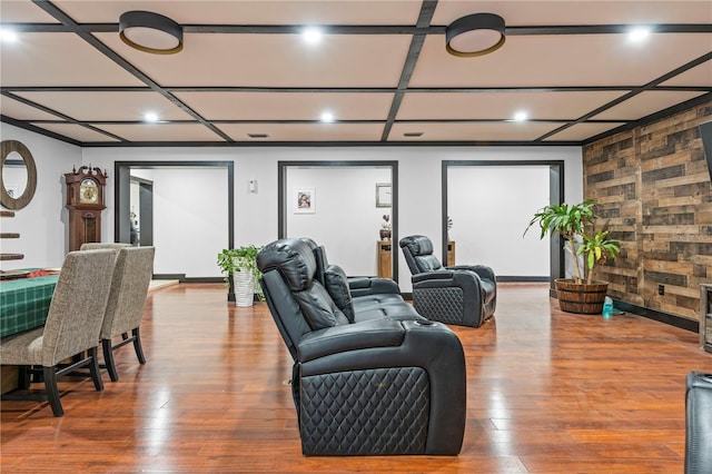 living room featuring coffered ceiling and wood-type flooring