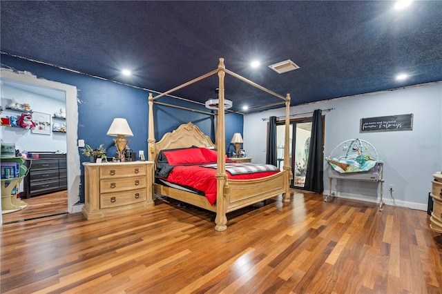 bedroom featuring wood-type flooring