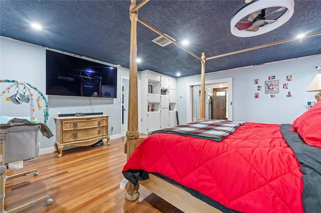 bedroom featuring hardwood / wood-style flooring