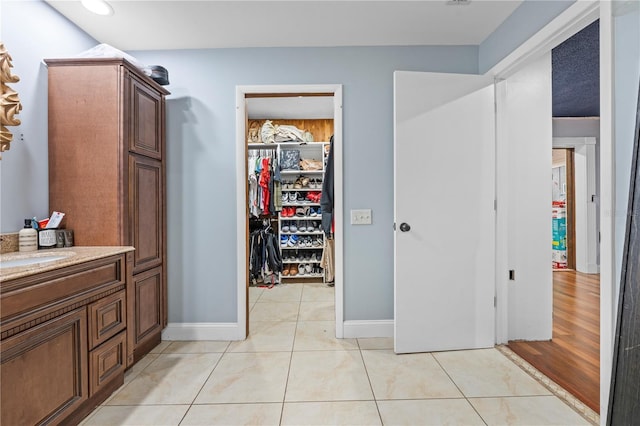 bathroom featuring tile patterned floors and vanity