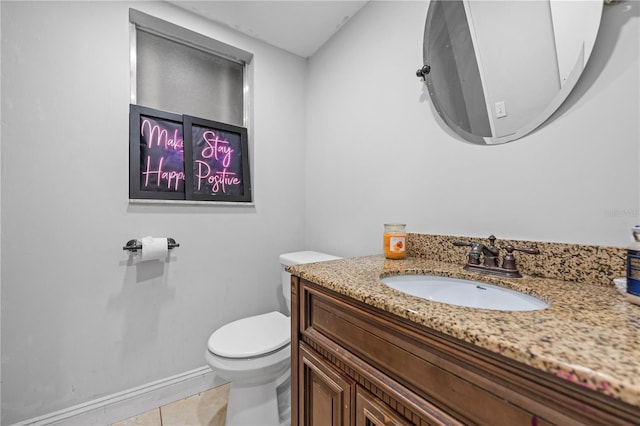 bathroom featuring vanity, toilet, and tile patterned floors