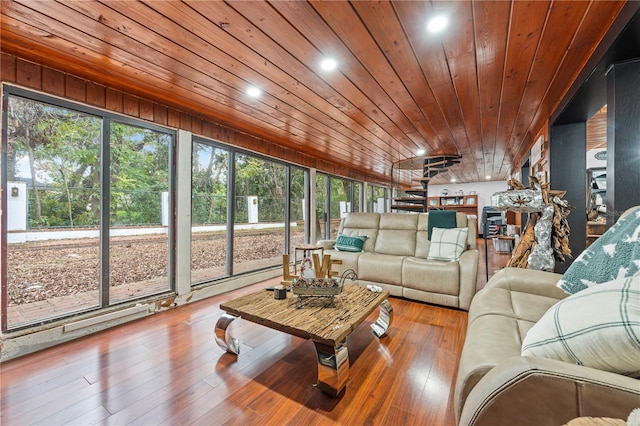 sunroom with plenty of natural light and wood ceiling