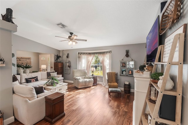 living room featuring hardwood / wood-style flooring, lofted ceiling, and ceiling fan