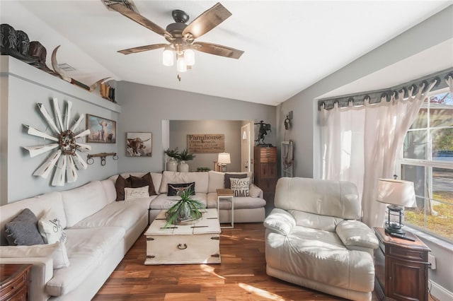 living room featuring ceiling fan, vaulted ceiling, and dark hardwood / wood-style flooring