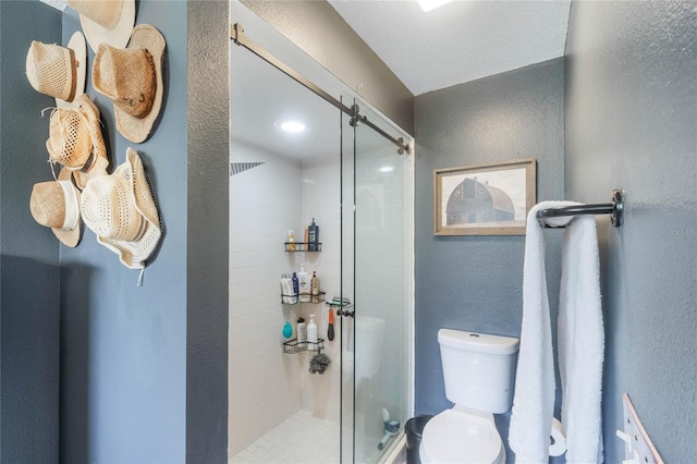 bathroom featuring toilet and walk in shower