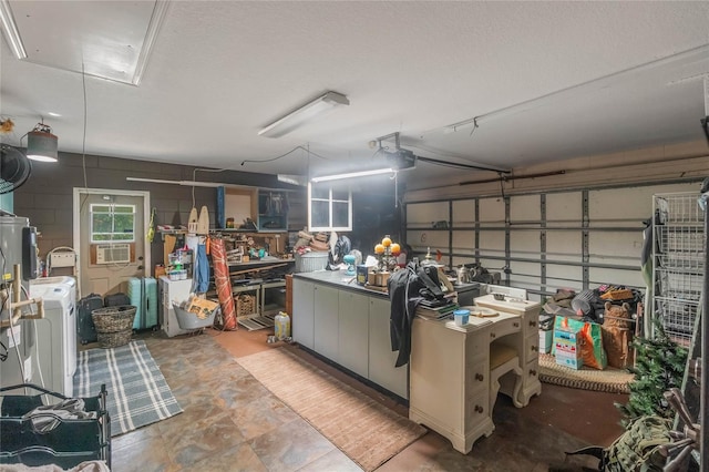 garage with washer / dryer and a garage door opener