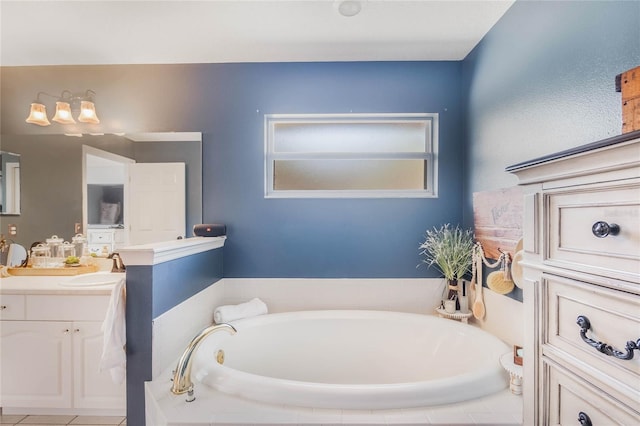 bathroom with tiled tub and vanity