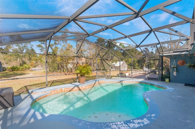 view of pool featuring a patio and glass enclosure