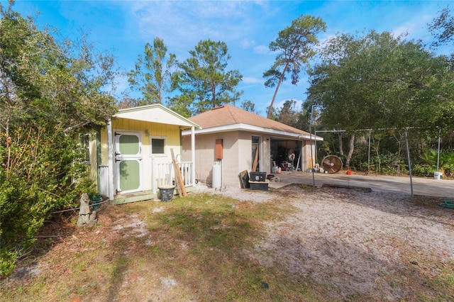 rear view of property with a shed