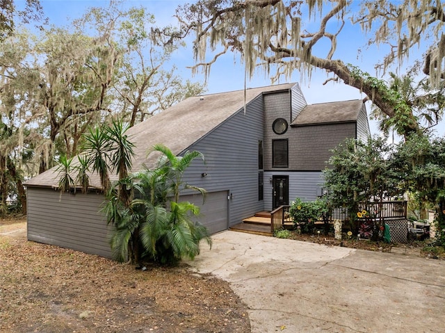 view of side of home with a garage