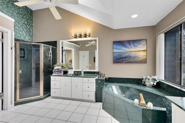 bathroom featuring separate shower and tub, vanity, tile patterned flooring, vaulted ceiling, and ceiling fan