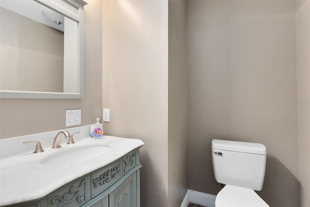 bathroom with toilet and vanity