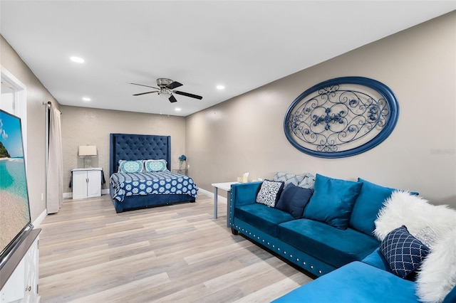 bedroom with ceiling fan and light hardwood / wood-style floors