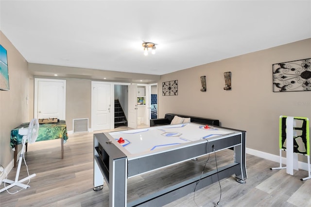 playroom featuring light wood-type flooring