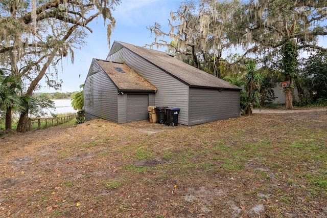 view of side of property featuring a garage