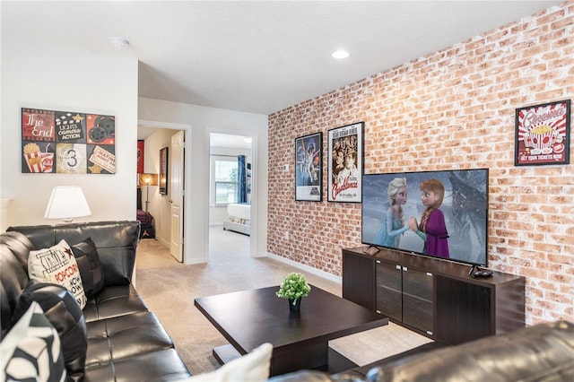 living room with brick wall and light colored carpet