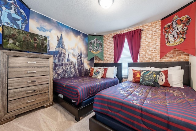 carpeted bedroom featuring a textured ceiling and brick wall