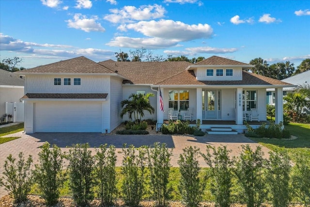 view of front facade with a garage and covered porch