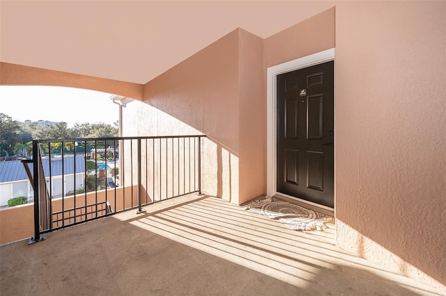 entrance to property featuring a balcony