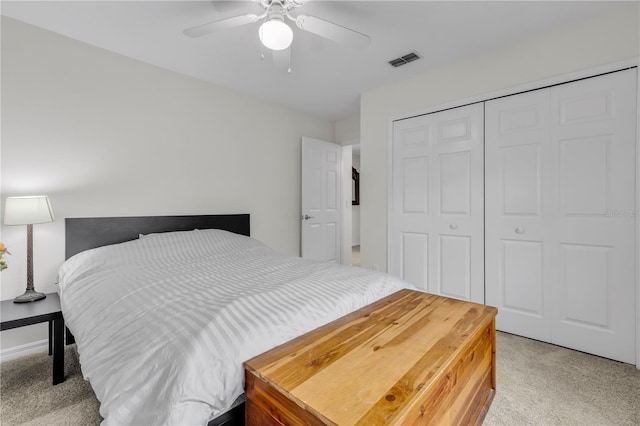 carpeted bedroom with a closet and ceiling fan