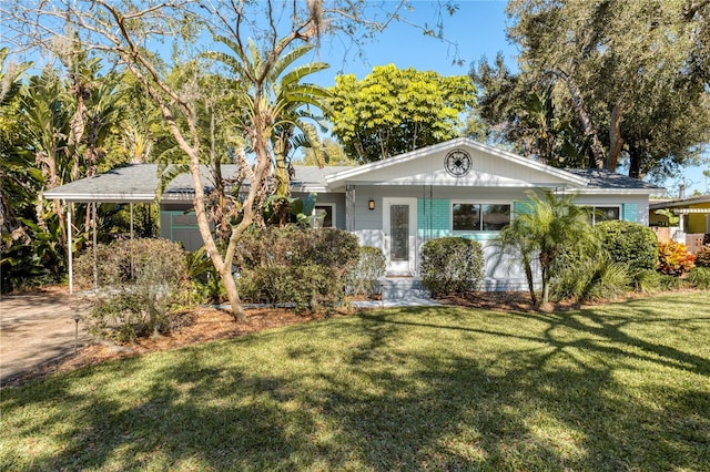 ranch-style house with a carport and a front lawn