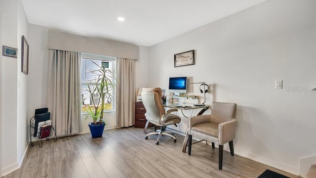 home office featuring light hardwood / wood-style floors