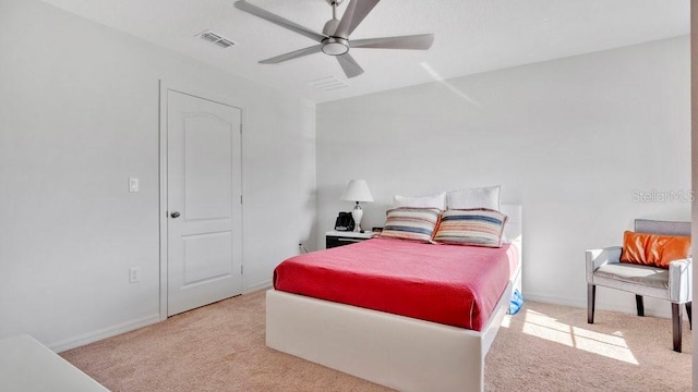 bedroom featuring ceiling fan and light carpet