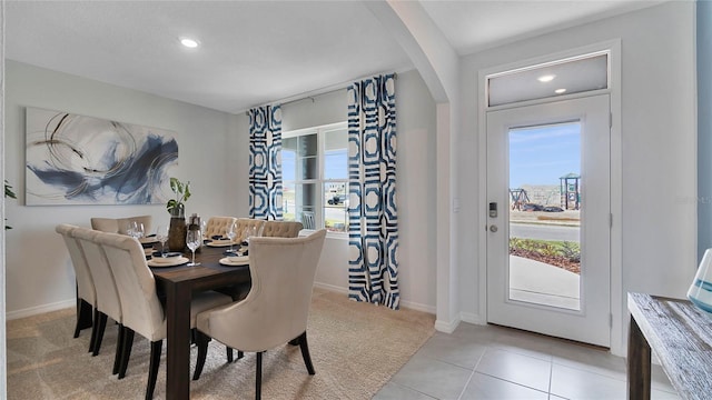 dining area featuring light tile patterned floors