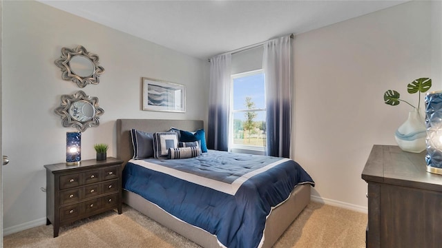 bedroom featuring light carpet