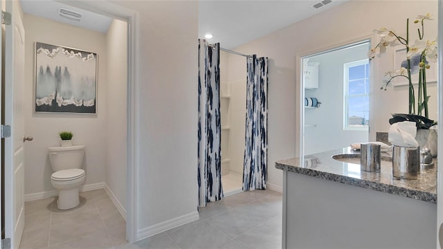 bathroom with toilet, a shower with shower curtain, tile patterned flooring, and vanity