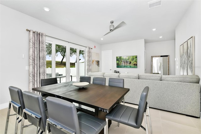 dining area with light tile patterned flooring and french doors