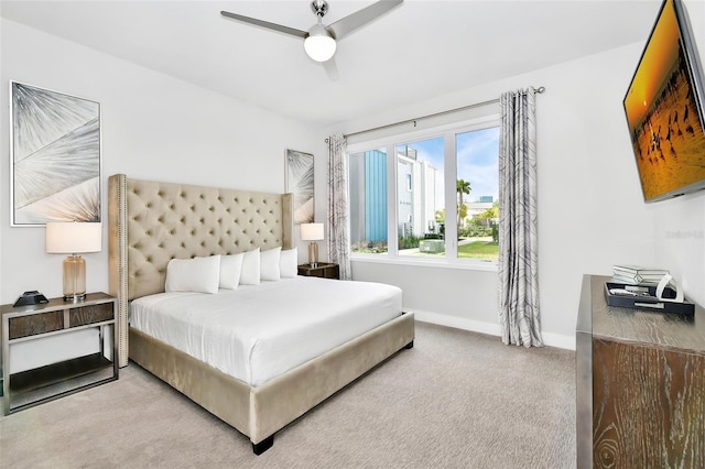 bedroom featuring ceiling fan and light carpet