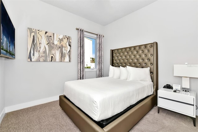 bedroom with light colored carpet