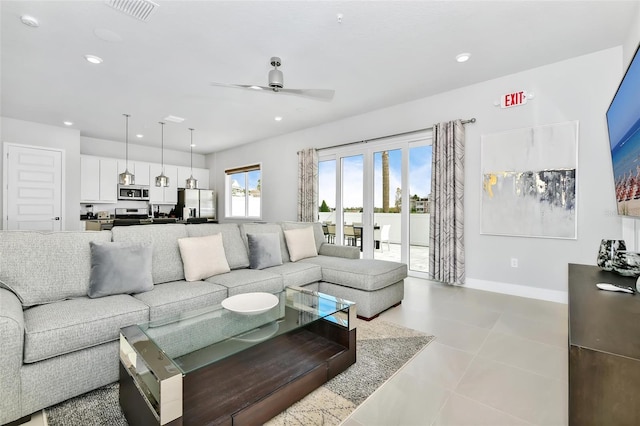 living room featuring french doors, ceiling fan, and light tile patterned floors