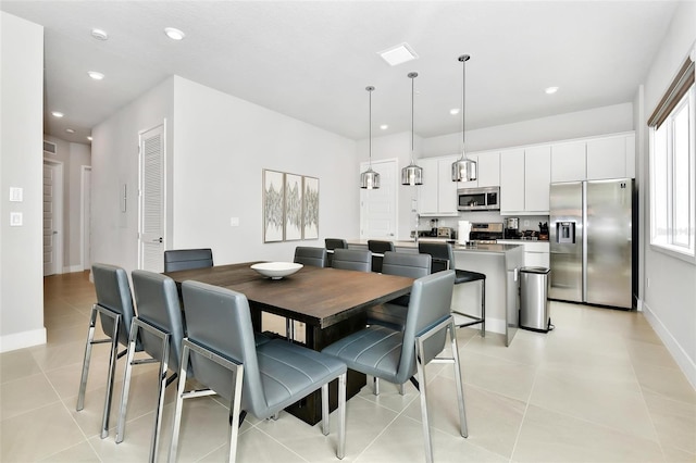 dining room featuring light tile patterned floors