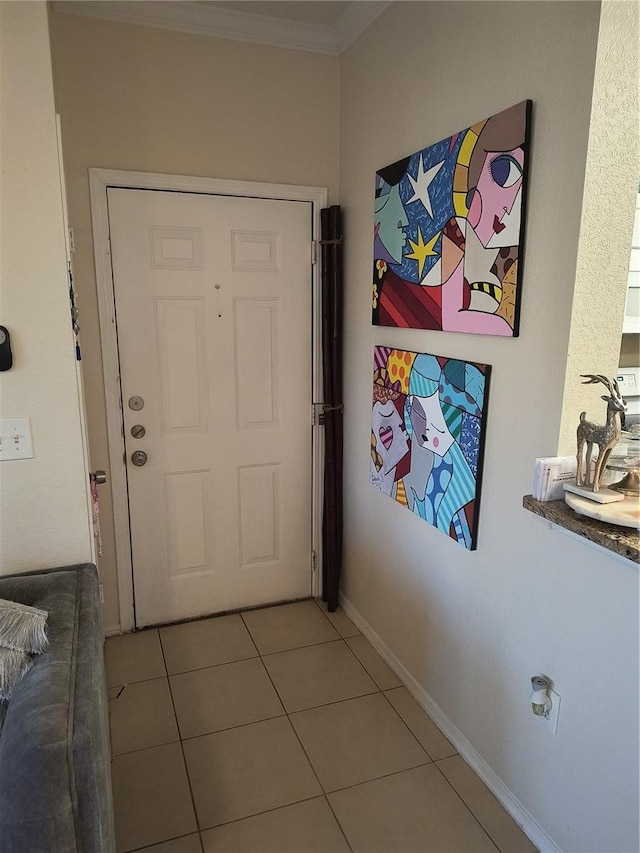 doorway with tile patterned floors and crown molding