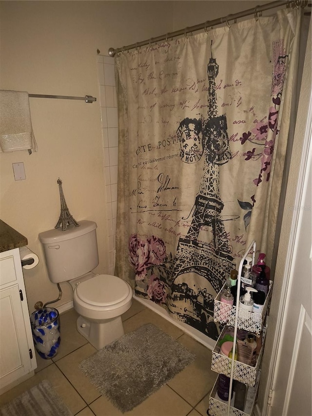 bathroom featuring tile patterned floors, vanity, toilet, and a shower with shower curtain