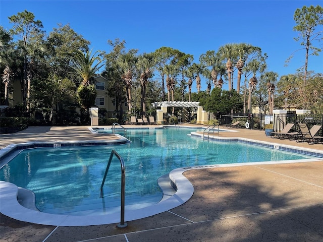 view of swimming pool with a patio area