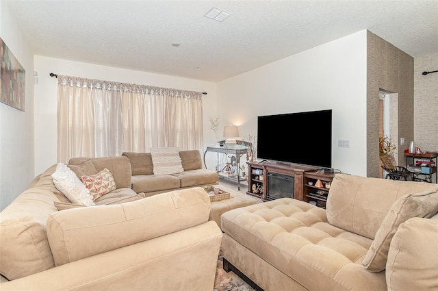 living room featuring a textured ceiling