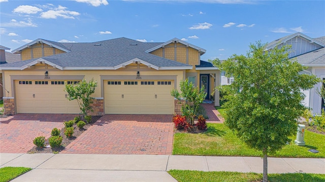 craftsman-style house with a garage and a front yard