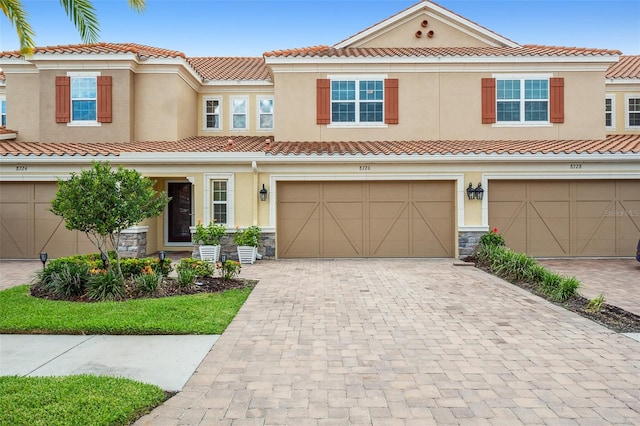 mediterranean / spanish-style home featuring a garage