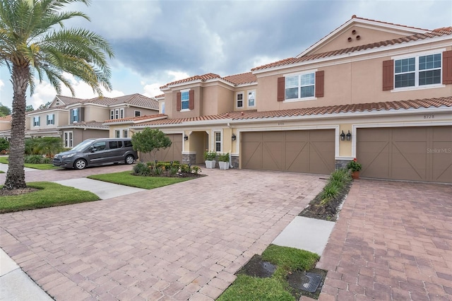 mediterranean / spanish-style home featuring a garage