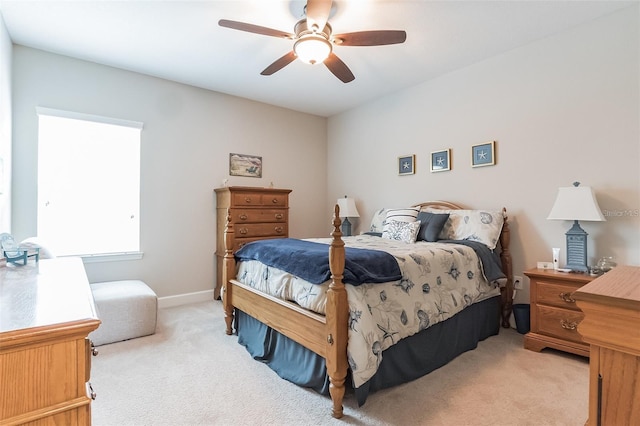 bedroom featuring ceiling fan and light colored carpet