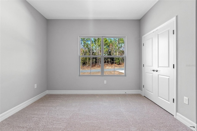 unfurnished bedroom featuring carpet floors